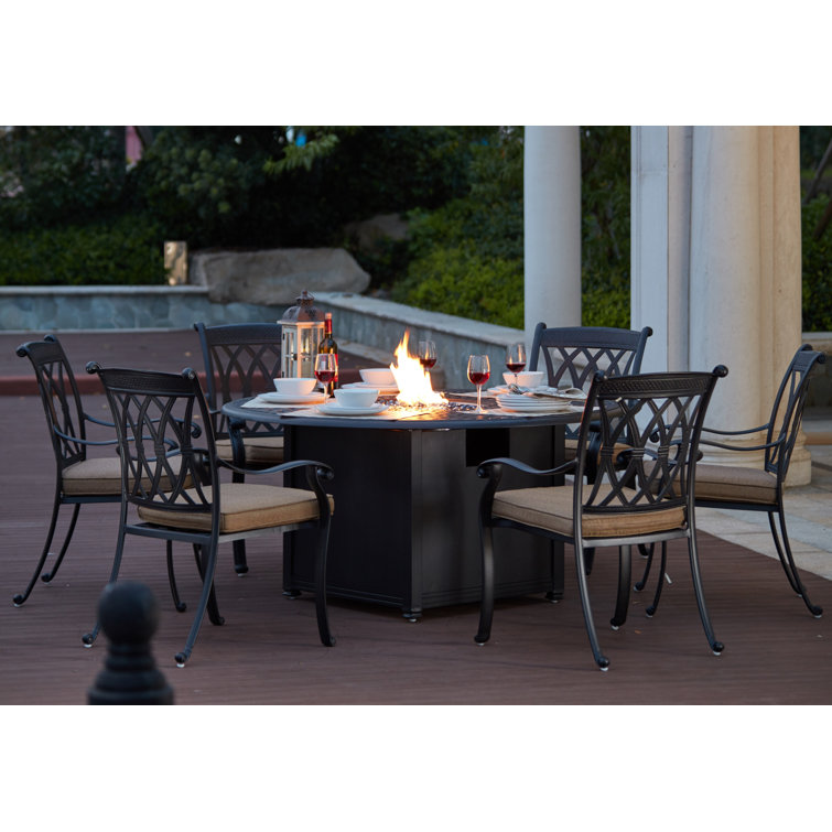 Melchior 7 Piece Patio Propane Fire Pit Dining Set with Cushions and 60 Round Fire Pit Dining Table